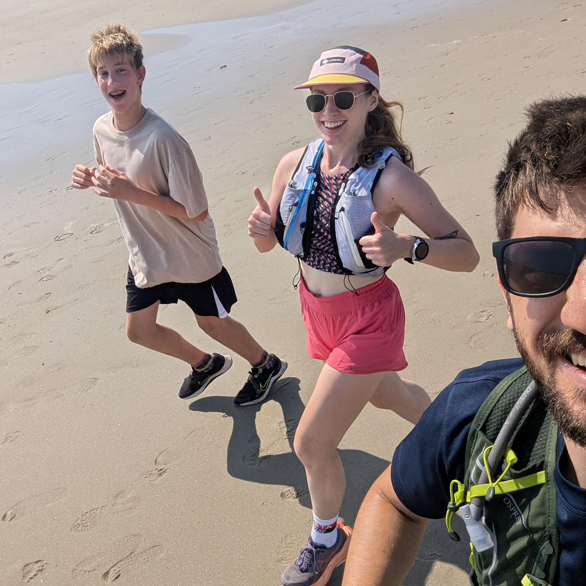 Running on the beach with a group
