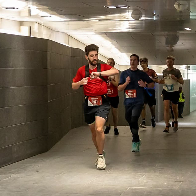 Checking a smartwatch mid-run indoors